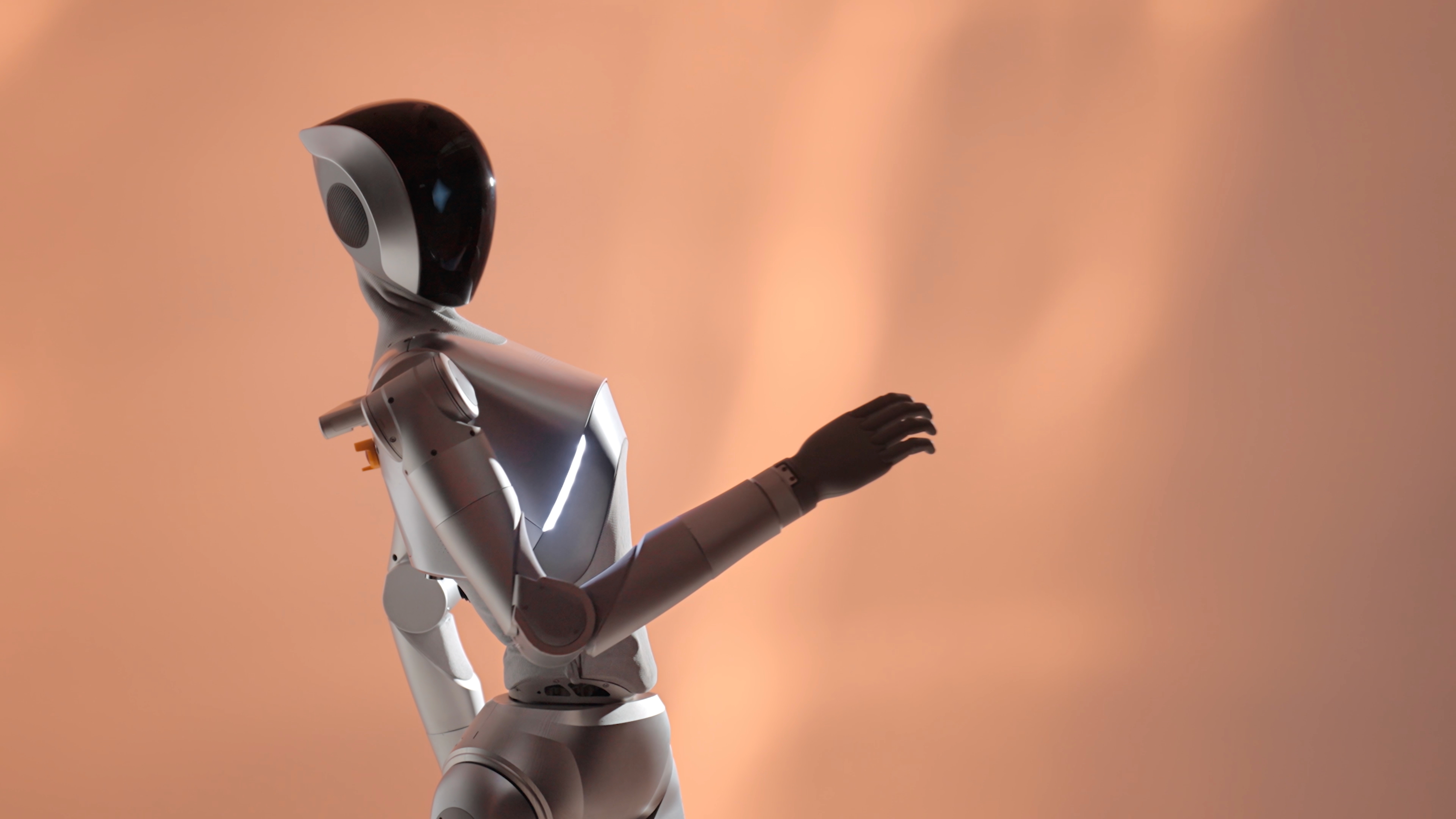 Figure 11.3: Physical LimX Luna extending one arm in an official launch studio scene. Its exterior, joints, and hand configuration are visible, but the photograph does not verify unscripted task autonomy, safety in crowds, or all-day availability. Source: LimX Dynamics official Luna launch page, https://www.limxdynamics.com/en/news/BK000062, fair use for academic review